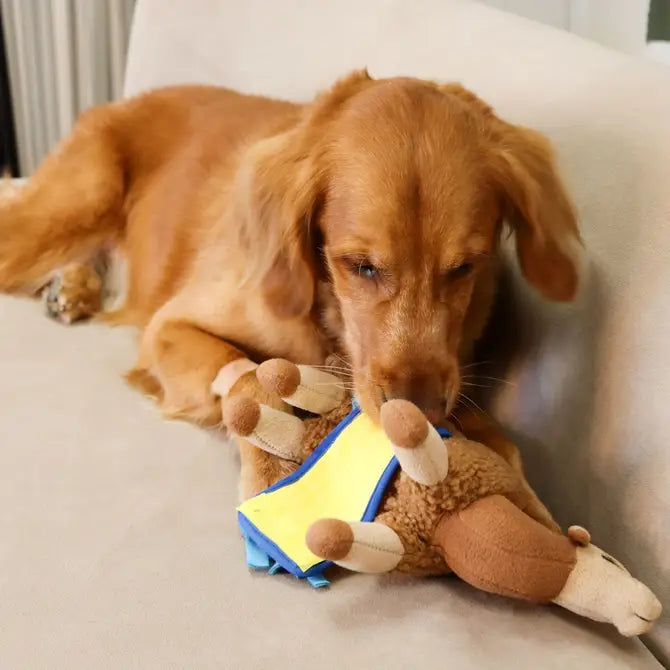 Dog enjoying the Sahara Camel Snuffle Toy, sniffing and foraging for hidden treats, promoting natural eating habits and reducing anxiety.