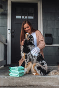 Load image into Gallery viewer, Close-up of Pet Glove Wipes' textured surface, ideal for removing pet dander and dirt, while hydrating and soothing your pet's skin.
